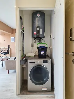 a washer and dryer in a living room at Spacio 299 by Geko in Lima
