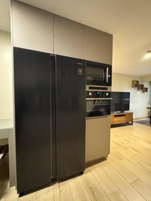 a kitchen with a black refrigerator in a room at Miraflores 1 Bedroom Executive Apartment in Lima