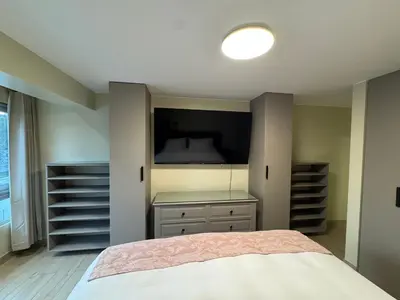 a bedroom with a large bed and a television at Miraflores 1 Bedroom Executive Apartment in Lima