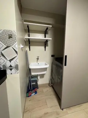 a small bathroom with a sink and a sink at Miraflores 1 Bedroom Executive Apartment in Lima