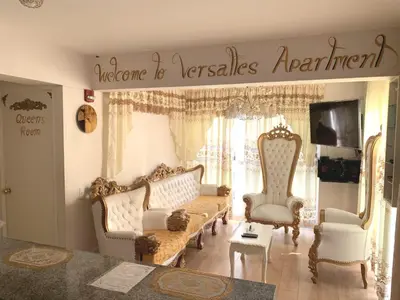 a living room with a couch and two chairs at Versalles Apartment in Lima