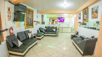 a waiting room with couches and chairs and a tv at VILLA andina cusco in Cusco