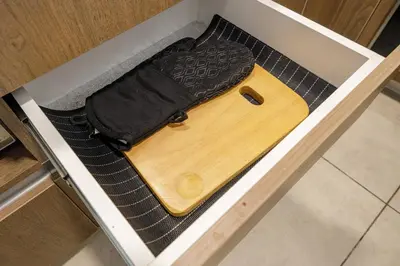 a wooden board in a drawer with a bag at BSR Cozy Flat next to Av. Javier Prado w/ Pool&Gym in Lima