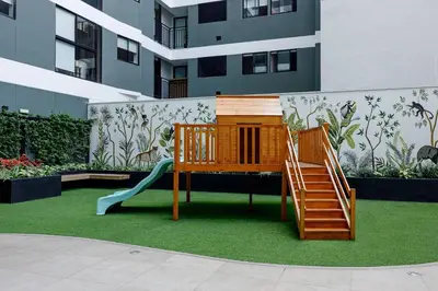 a playground with a slide and a slideintend at BSR Cozy Flat next to Av. Javier Prado w/ Pool&Gym in Lima