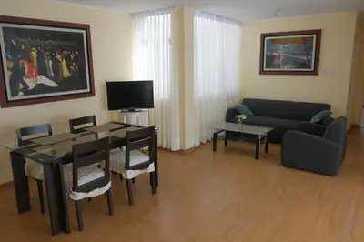 a living room with a couch and a table at Don Joaquin 1 in Lima