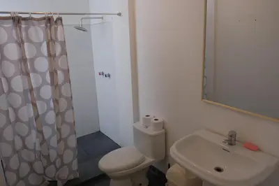 a bathroom with a toilet and a sink and a shower at Don Joaquin 1 in Lima