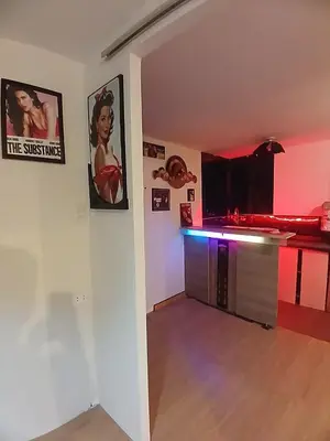 a living room with a bar with pink lighting at Freestyle Home in Lima