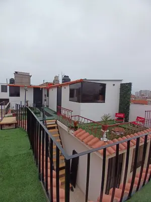 a house with a balcony with a boat on it at Freestyle Home in Lima