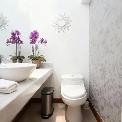 a bathroom with a toilet and a sink at E Malecon Larcomar Free Parking 3B 102 in Lima