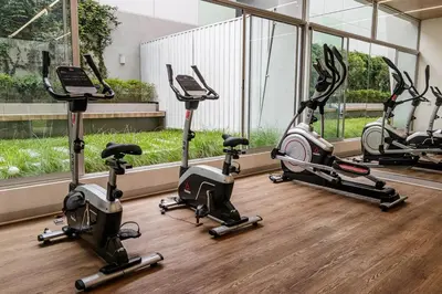 a row of exercise bikes in a gym at Urbana Perú Tempo in Lima