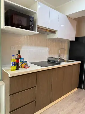 a kitchen with a sink and a counter top at The Sight in Lima