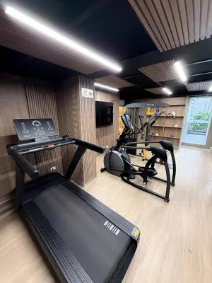 a gym with two treadmills and two exercise bikes at The Sight in Lima