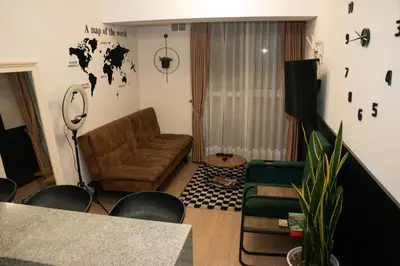 a living room with a couch and a table at Casa viajera - orla los topacios in Lima