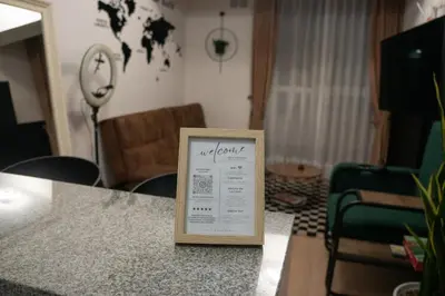 a sign sitting on a table in a living room at Casa viajera - orla los topacios in Lima
