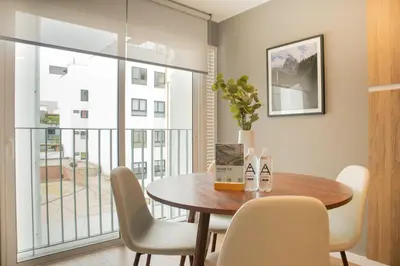 a dining room with a table and chairs at Fanning Apartments by Wynwood House in Lima