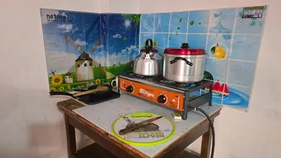 a miniature kitchen with a stove with a pot on it at Refugio Sagrado Boutique in Ollantaytambo