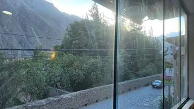 a view from a window of a mountain road at Refugio Sagrado Boutique in Ollantaytambo