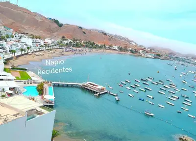 a group of boats in the water at a harbor at Confortable con vista al mar de Naplo, Pucusana in Pucusana