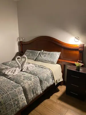a bedroom with a bed with a heart decoration on it at Casa Olivo in Lima