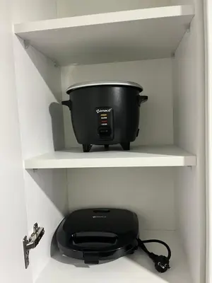 a black pot on a shelf in a kitchen at Miraflores premiere apartment in Lima