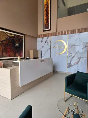 a lobby of a museum with a reception desk at MOON Edificio in San Vicente de Cañete