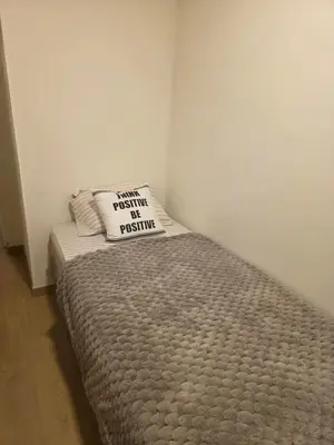 a small bedroom with a bed with a pillow on it at Habitación en Apartamento Pueblo Libre in Lima