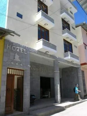 a man walking in front of a hotel at Hotel Tambo del Inca in Cajatambo