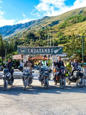 a group of people riding motorcycles on a road at Hotel Tambo del Inca in Cajatambo
