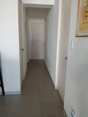 an empty hallway with a door and a tile floor at Aqua y Sol Private Pool Parking Air Conditioning in Playa de Santa María