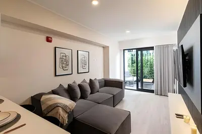 a living room with a couch and a table at Artline Terrace Residence in Lima