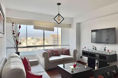 a living room with a couch and a table at Big 3BR Apartment in the center of Miraflores in Lima