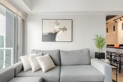 a living room with a gray couch and a table at Contemporary Great View in Lima
