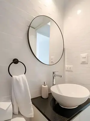 a bathroom with a sink and a mirror at Exclusive Apartment in Miraflores in Lima
