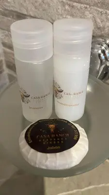 two cups and a plate on a glass table at C4s4 RANCH OXAPAMPA in Oxapampa