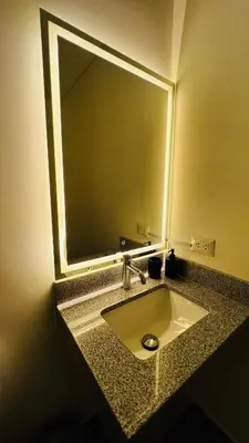 a bathroom sink with a large mirror above it at Piso 25 con vista panorámica in Lima