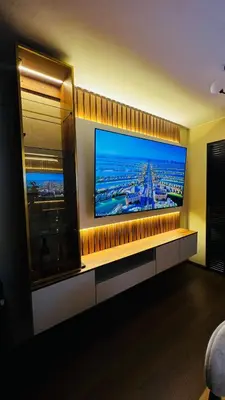 a room with a large flat screen tv on a wall at Piso 25 con vista panorámica in Lima