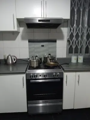 a kitchen with two pots on a stove at Apartment in the center of Miraflores in Lima