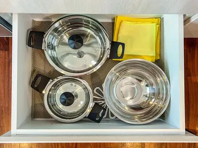 a drawer filled with three pots and pans at LimaViva A in Lima