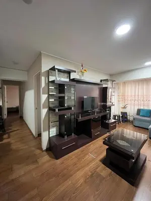 a living room with a room with a couch and a tv at Habitación con cama matrimonial en dpto tipo roomie in Lima
