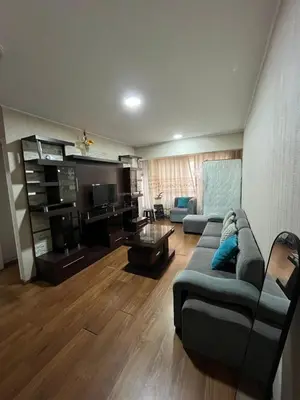 a living room with a couch and a table at Habitación con cama matrimonial en dpto tipo roomie in Lima