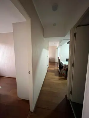 an empty hallway with a table in a room at Habitación con cama matrimonial en dpto tipo roomie in Lima