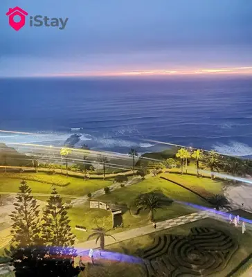 an aerial view of a park next to the ocean at iStay Espectacular Vista Mar Miraflores in Lima