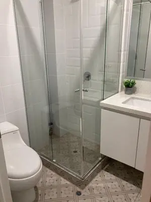 a bathroom with a shower and a toilet and a sink at iStay Santuario Linsidro Cerca Hospitales Gym in Lima