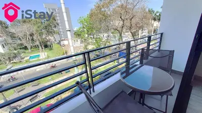 a table and chairs on a balcony with a view at iStay Nuevo 2D 2B Balcón in Lima