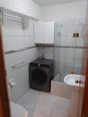 a bathroom with a washing machine and a sink at Miraflores, Lima, apartamento 1 dormitorio in Lima