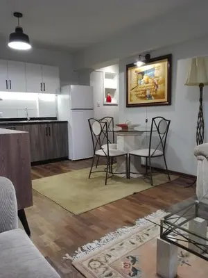a kitchen and living room with a table and chairs at Miraflores, Lima, apartamento 1 dormitorio in Lima