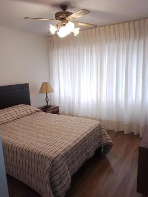 a bedroom with a bed and a ceiling fan at Miraflores, Lima, apartamento 1 dormitorio in Lima