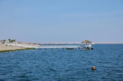 a pier in the middle of a body of water at PARACAS Sotavento T2 401 in Paracas