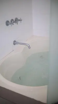 a bath tub with a faucet in a bathroom at PARACAS Sotavento T2 401 in Paracas