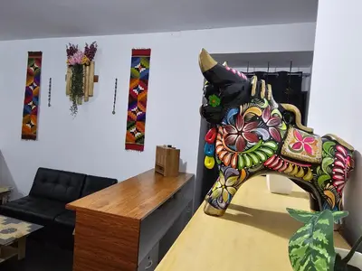 a room with a colorful elephant on the wall at Chakanas House in Cusco